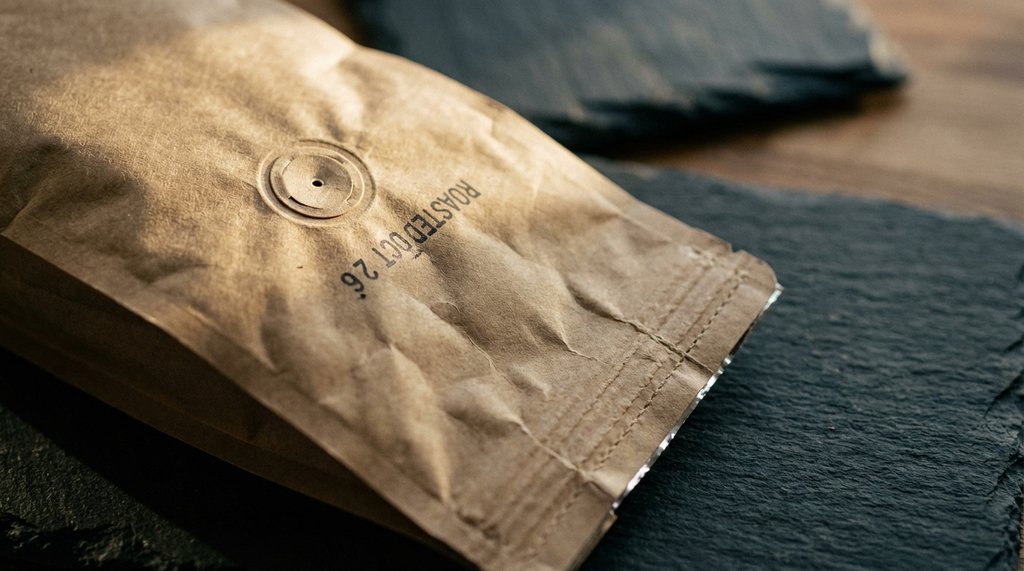 Close-up of Blue Bottle coffee bag with degassing valve and roast date stamp