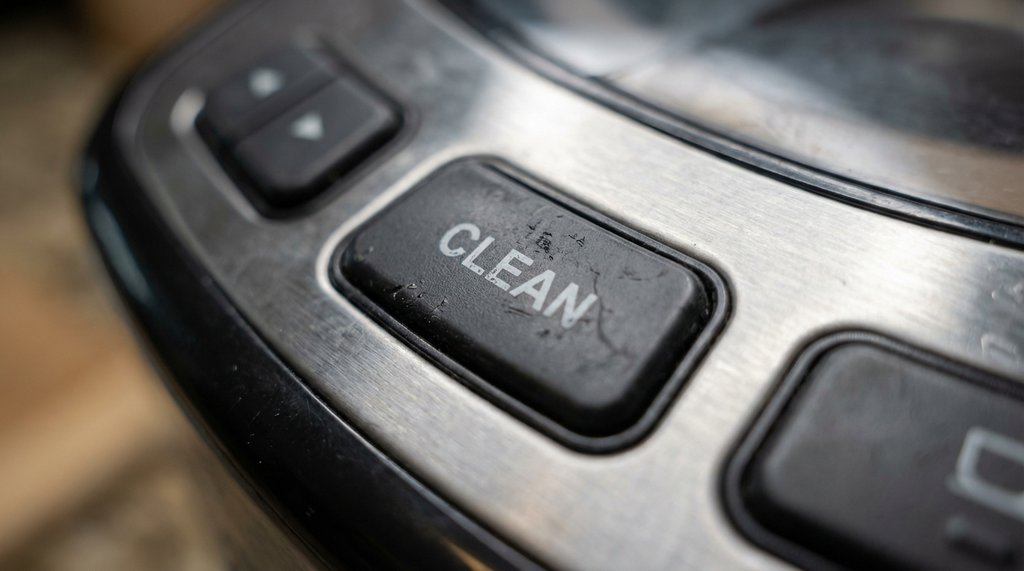 Close-up of worn Cuisinart coffee maker control panel button membrane
